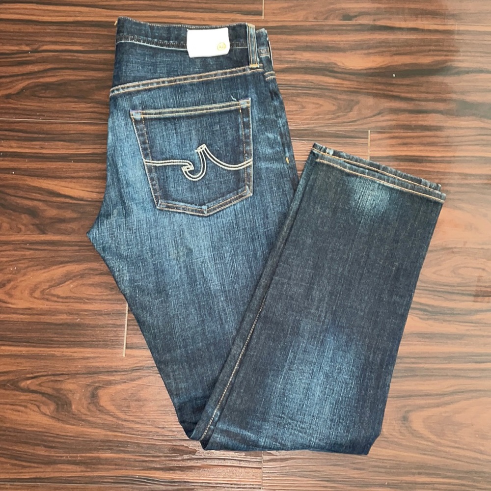 Adriano Goldschmied distress slouchy slim cut. Color-dark blue wash